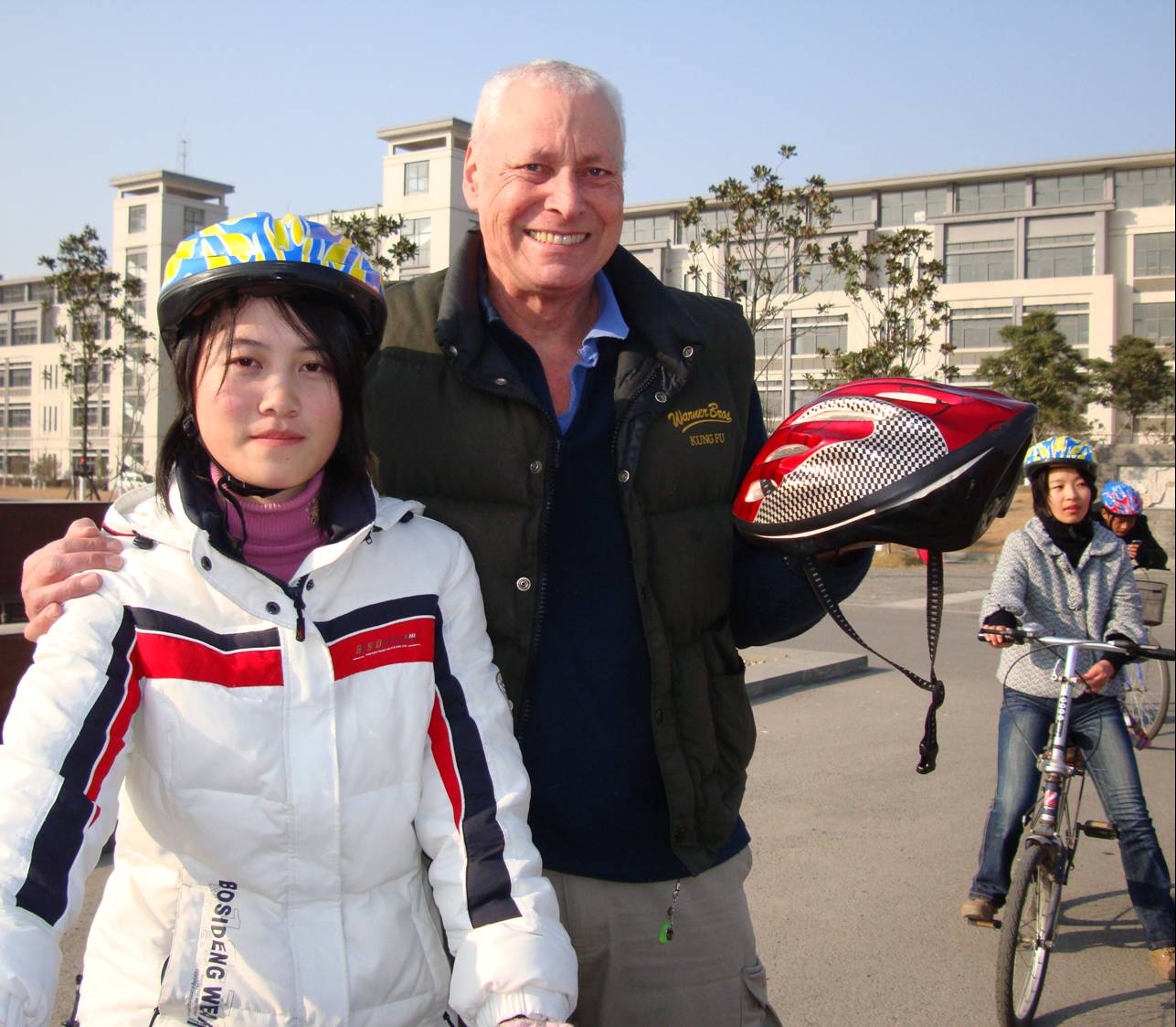 Picture: Click to see the article in the Yangze Evening Post. David Scott and student with bicycle helmet,  Jiangnan University,  Wuxi,  China