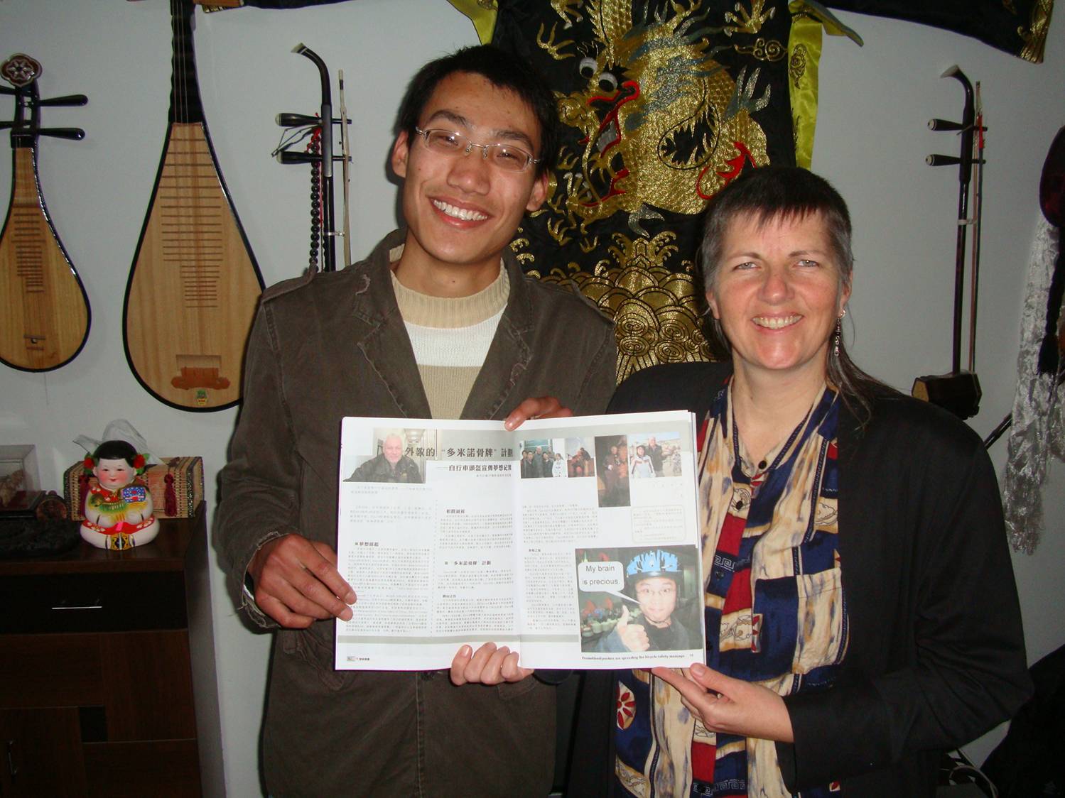 Picture: Edward delivers Lihu Magazine,  with a four page article on my helmet campaign.  Jiangnan University,  Wuxi,  China.